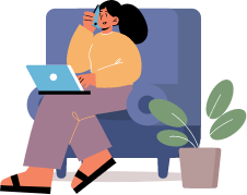 a person sitting on a chair with a laptop and a plant